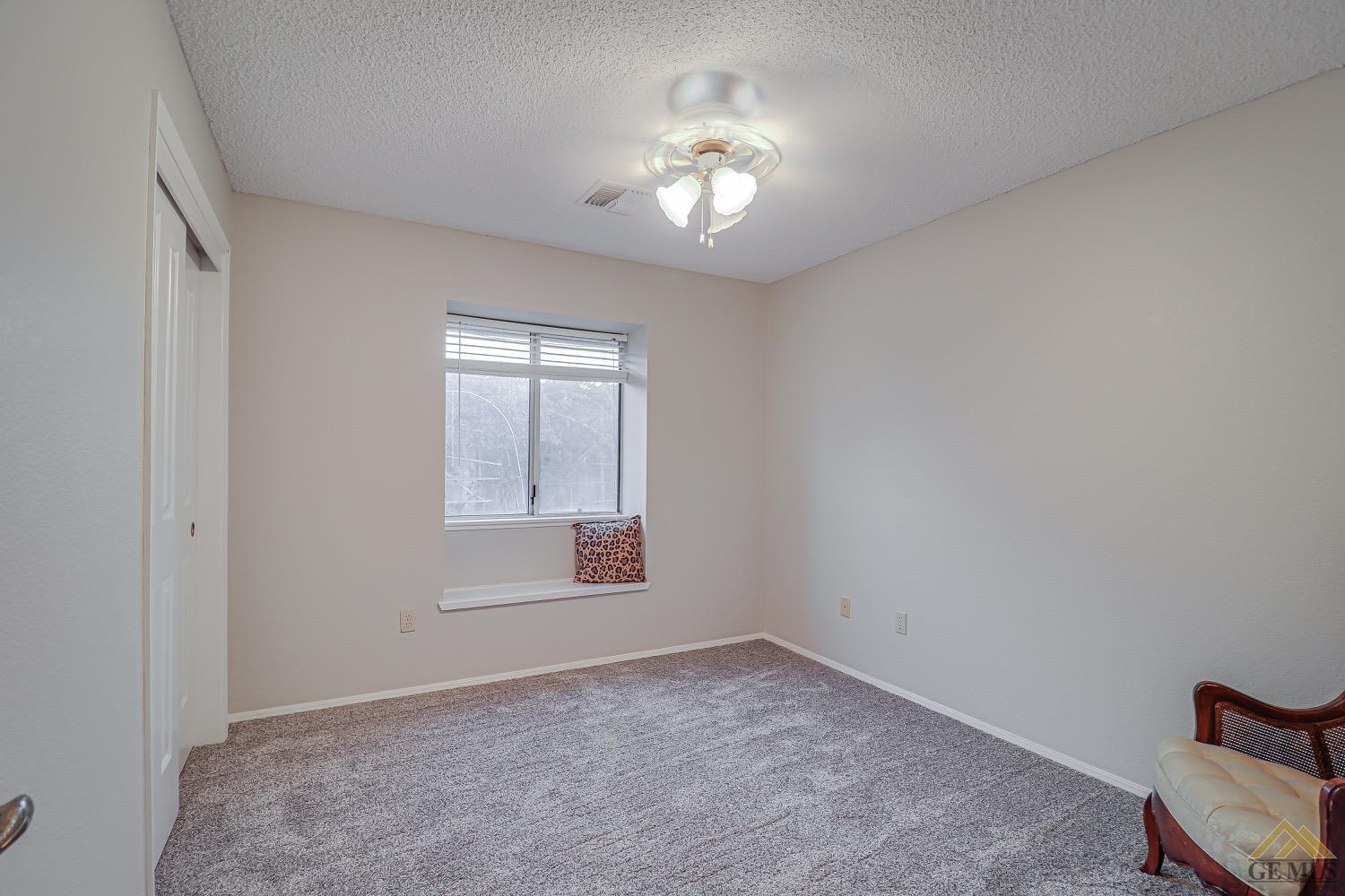 Undisclosed Address Bakersfield, CA 93314 - Photo 22 of 38 a view of an empty room with a window