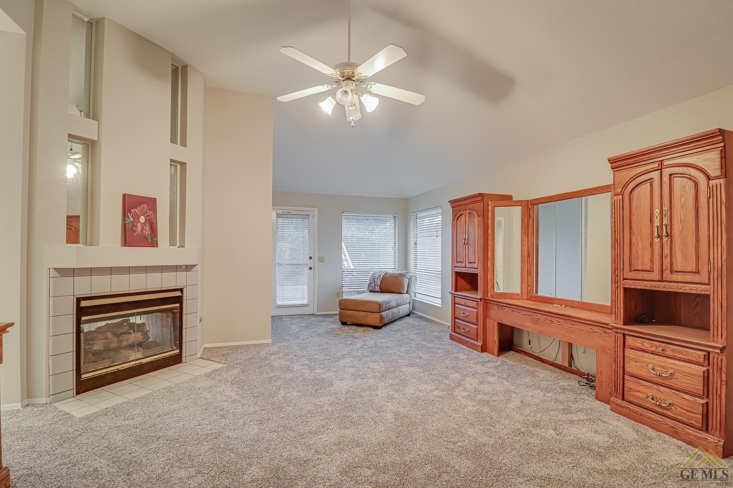 Undisclosed Address Bakersfield, CA 93314 - Photo 26 of 38 wooden floor fireplace and windows in an empty room