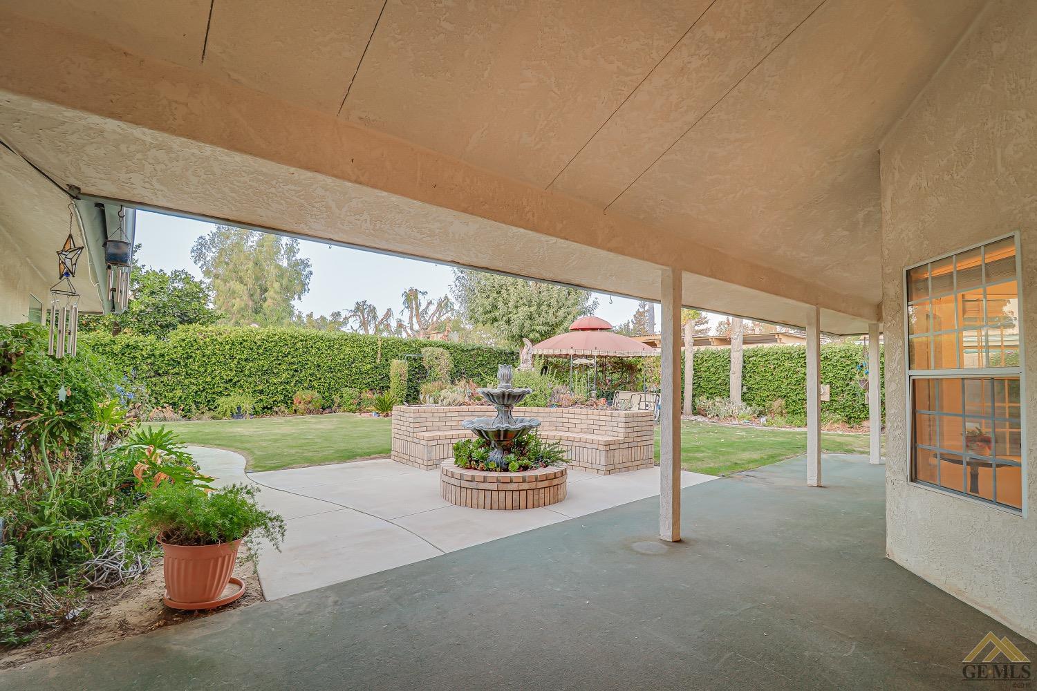 Undisclosed Address Bakersfield, CA 93314 - Photo 30 of 38 a view of a porch with furniture and a yard