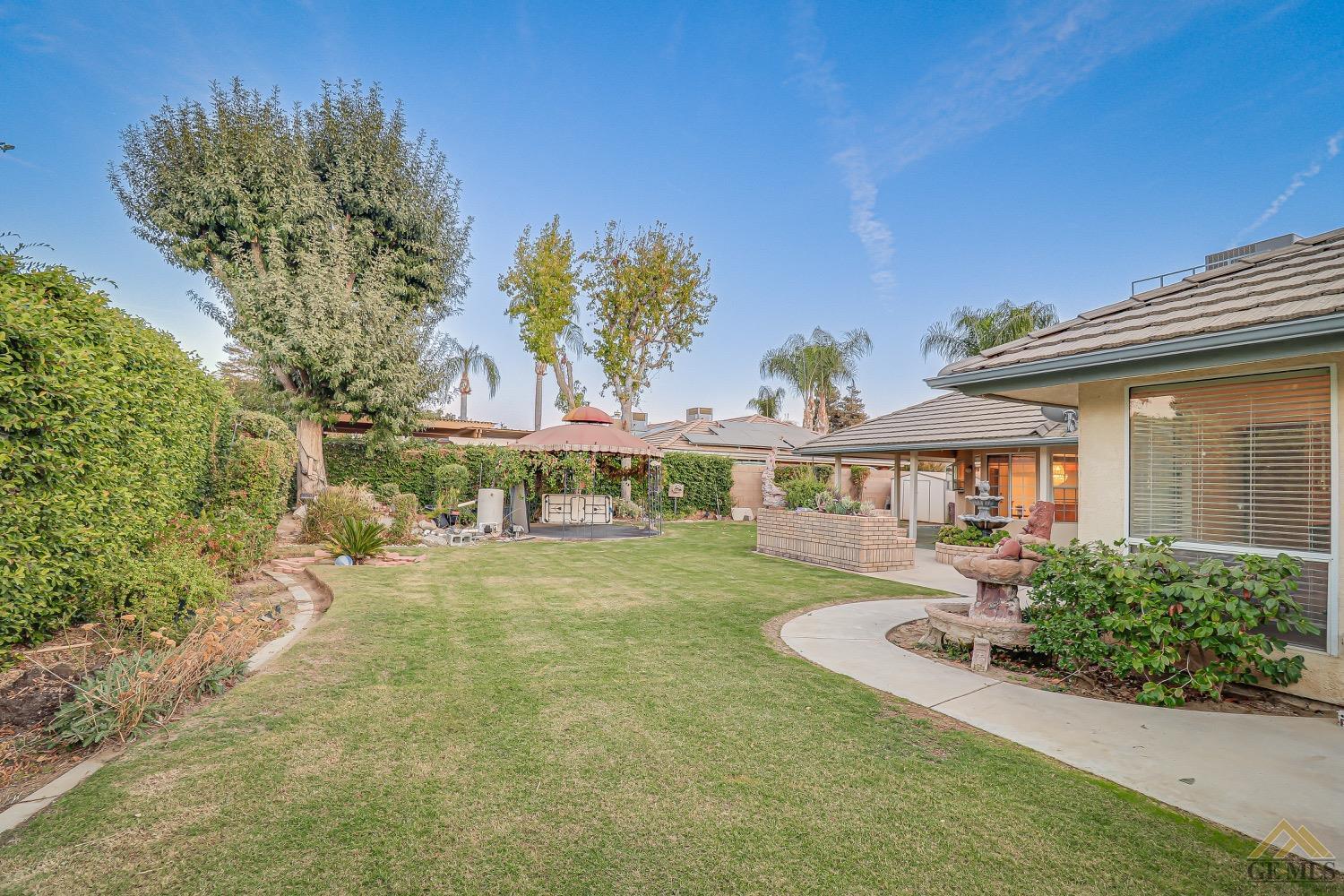 Undisclosed Address Bakersfield, CA 93314 - Photo 36 of 38 front view of a house with a big yard