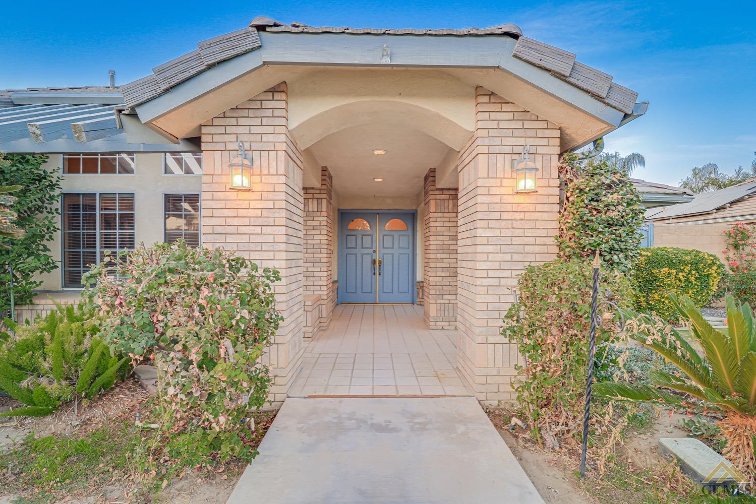 Undisclosed Address Bakersfield, CA 93314 - Photo 4 of 38 a view of a house with potted plants