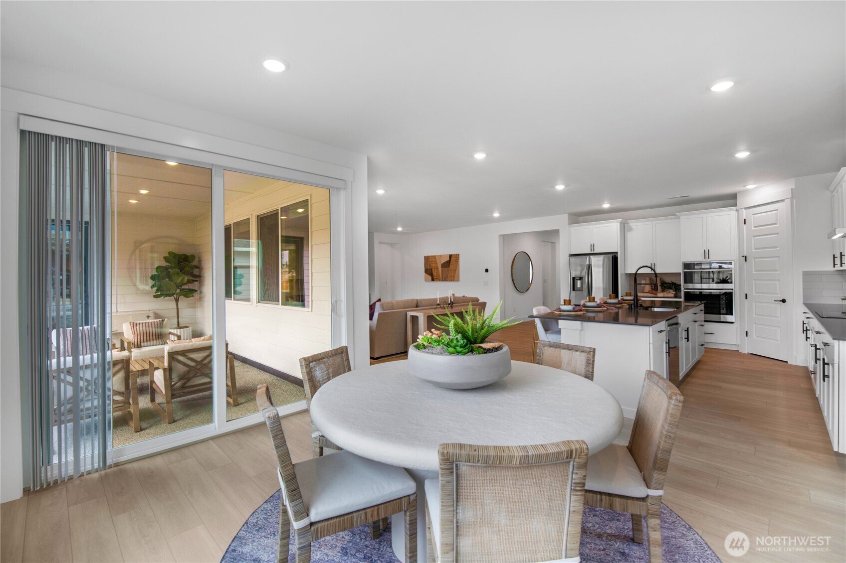 653 Gooseberry Place Sequim, WA 98382 - Photo 5 of 13 a kitchen with a table and chairs