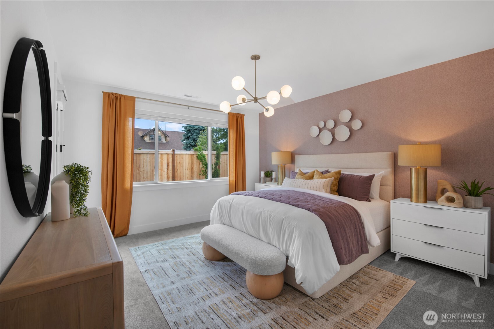 653 Gooseberry Place Sequim, WA 98382 - Photo 7 of 13 a bedroom with a bed a chandelier and dresser