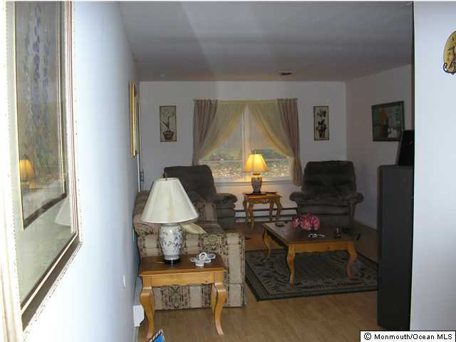16 Phillips Road Brick, NJ 08724 - Photo 3 of 3 a living room with furniture and a window
