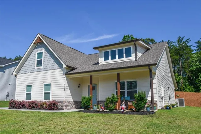 a front view of a house with garden