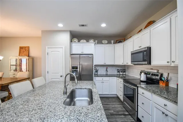 a bedroom with a bed and a ceiling fan