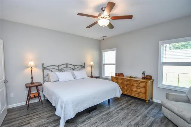 a bedroom with a bed and couch