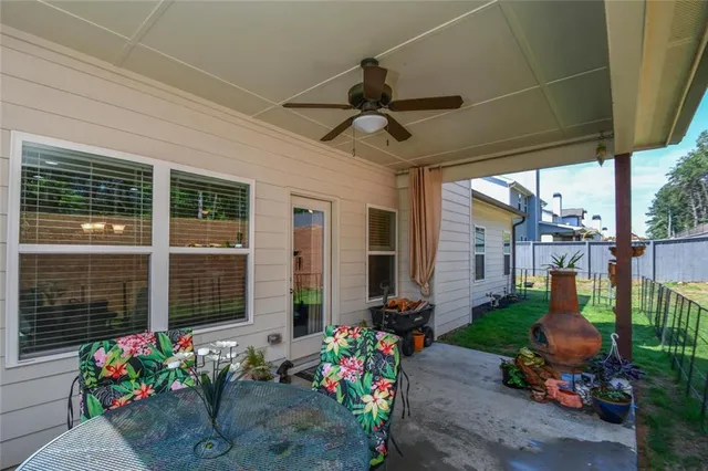 a aerial view of a house with table and chairs