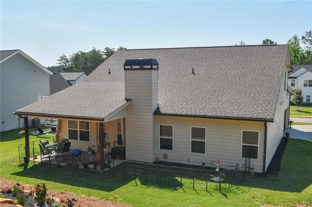 a view of a park with large trees