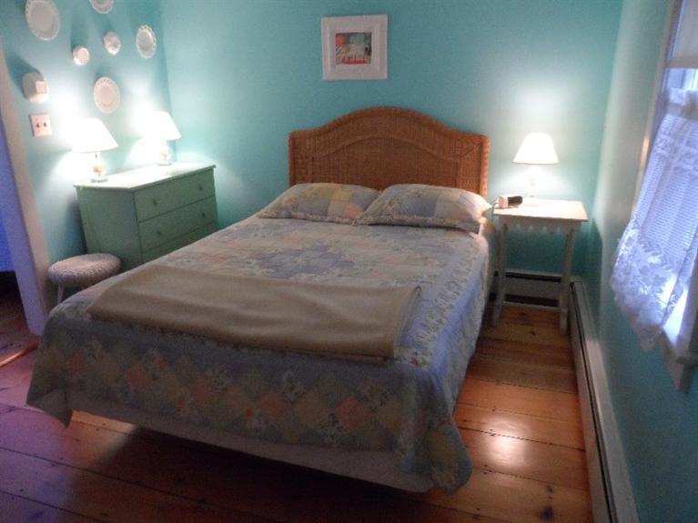 71 Gorham Road Harwich Port, MA 02646 - Photo 12 of 34 a bedroom with a bed and a lamp
