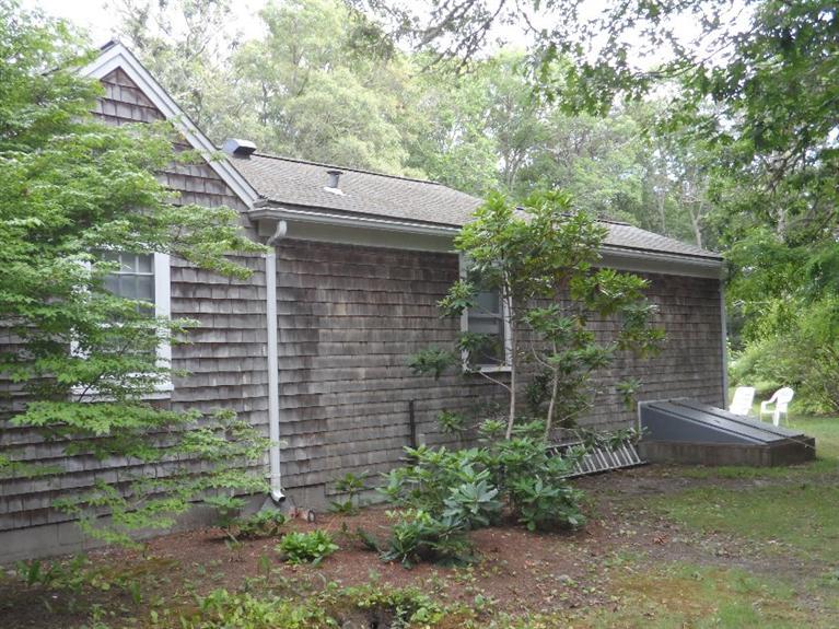 71 Gorham Road Harwich Port, MA 02646 - Photo 34 of 34 a view of a backyard with plants and large trees