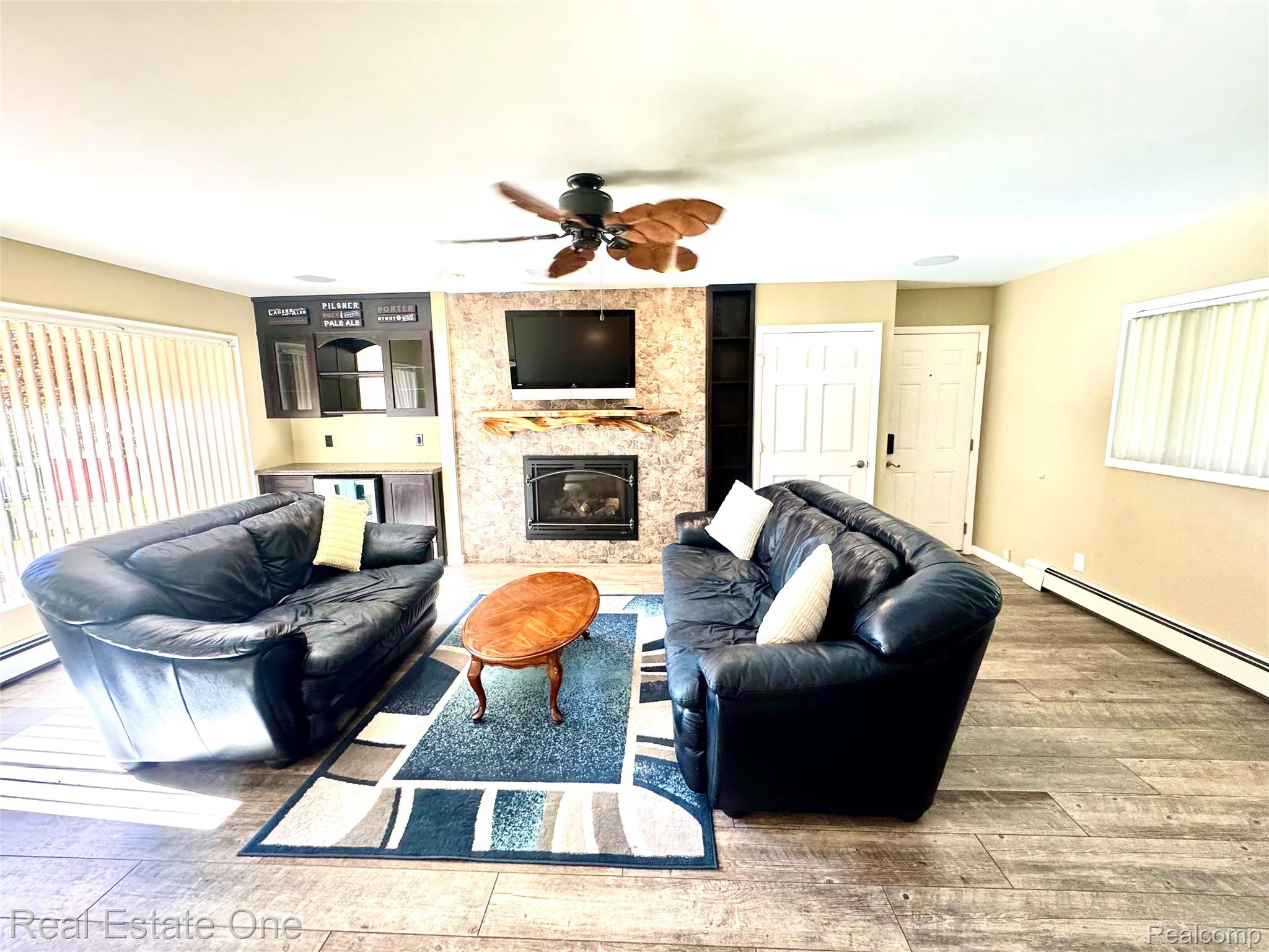 615 Willard Avenue Rochester, MI 48307 - Photo 3 of 30 Living area featuring wood-finish flooring and a ceiling fan
