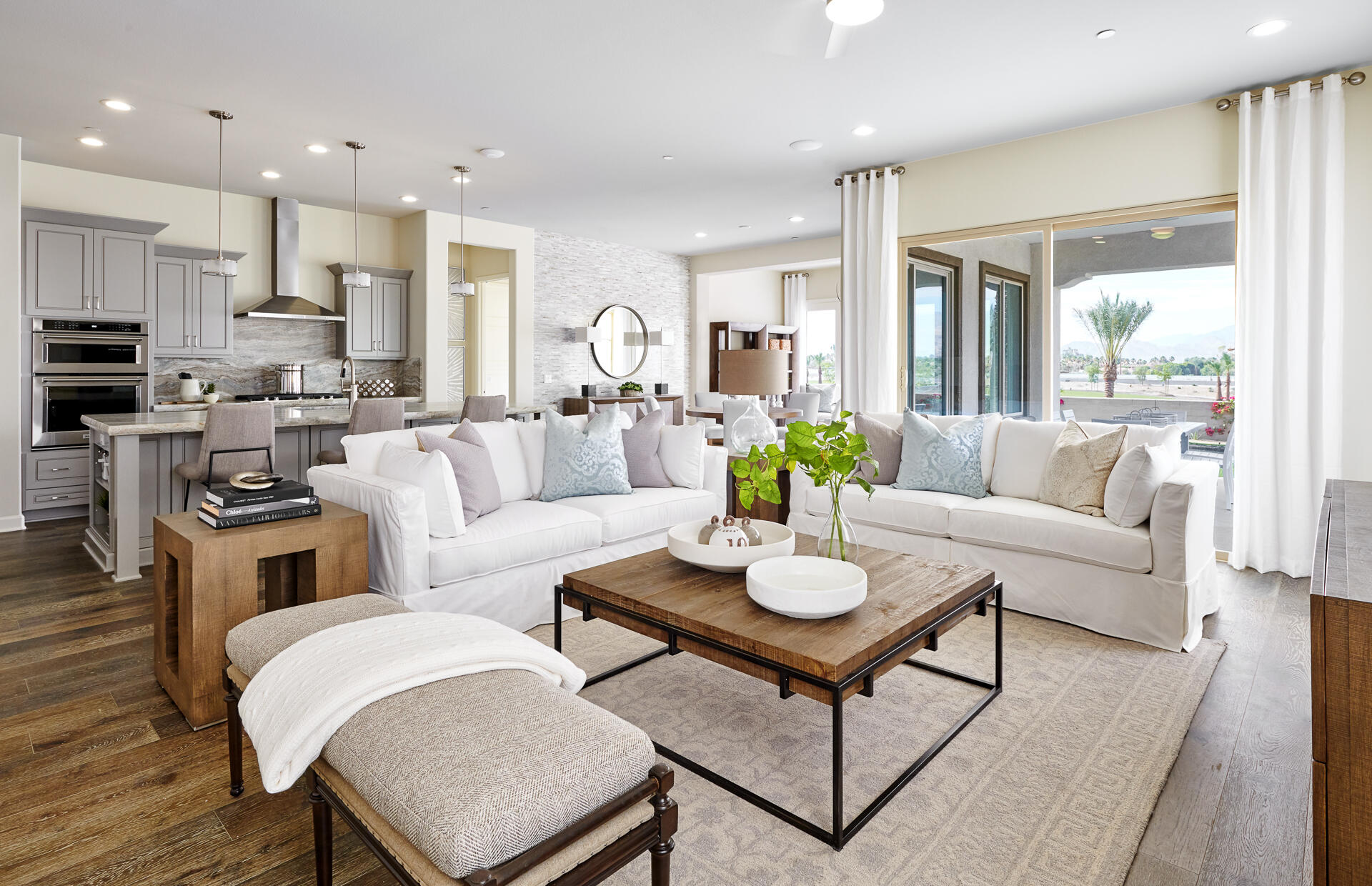 36 Chablis Rancho Mirage, CA 92270 - Photo 3 of 12 a living room with furniture kitchen view and a wooden floor
