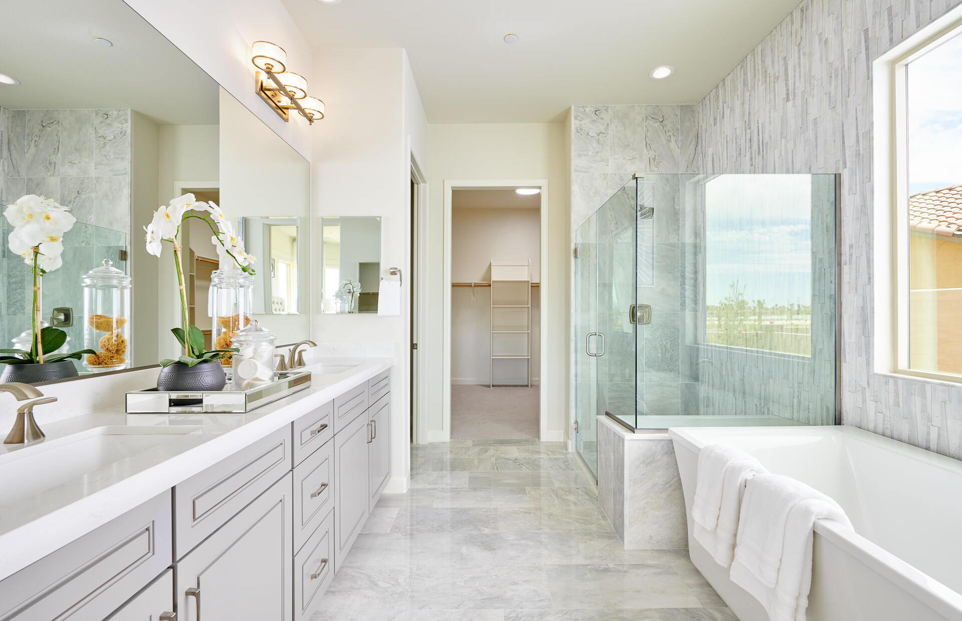36 Chablis Rancho Mirage, CA 92270 - Photo 8 of 12 a spacious bathroom with a double vanity sink a large mirror a bathtub and shower
