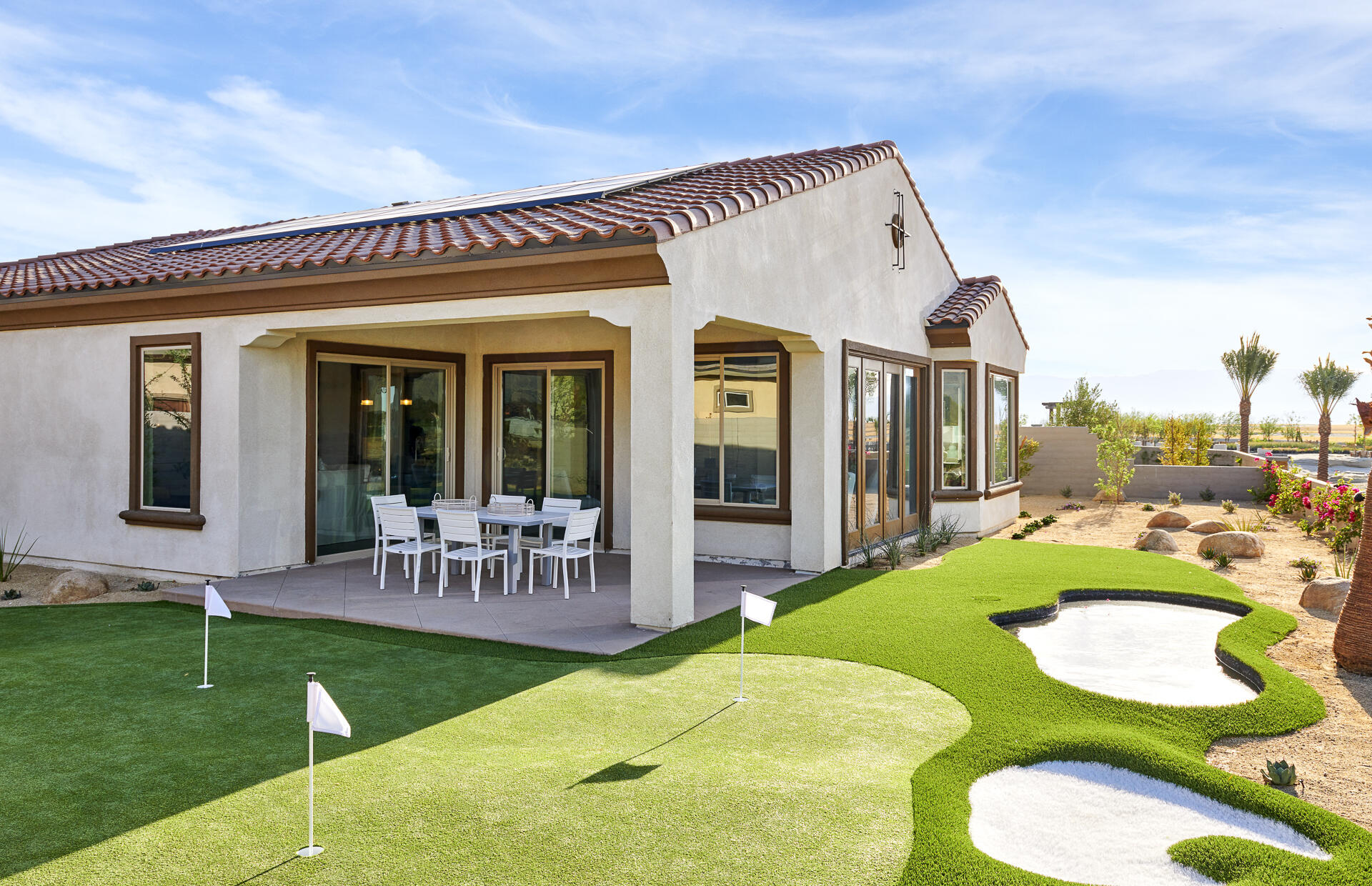 36 Chablis Rancho Mirage, CA 92270 - Photo 9 of 12 a view of a house with a swimming pool and furniture