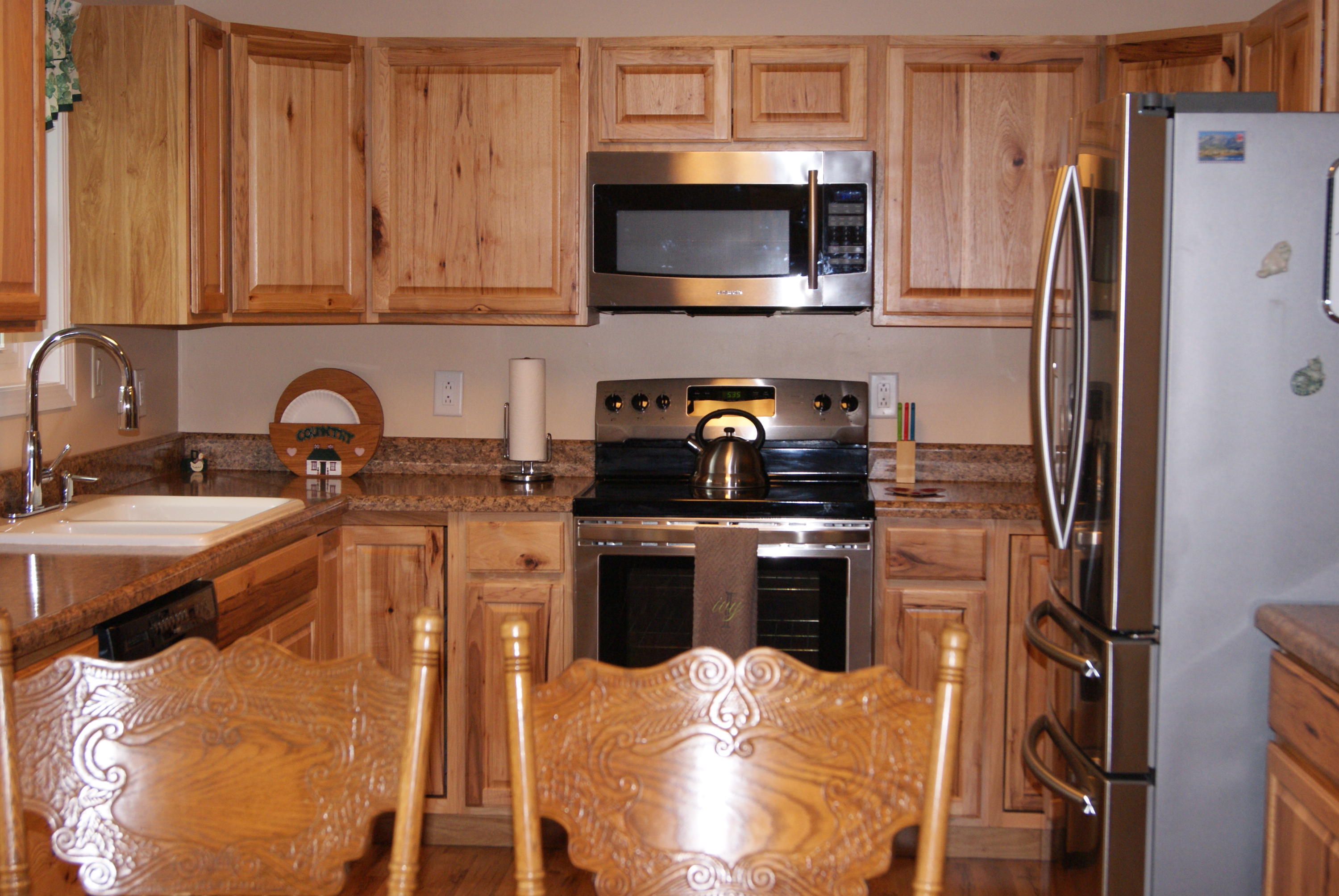 1137 Country Living Road Baker, FL 32531 - Photo 11 of 29 a kitchen with stainless steel appliances granite countertop a refrigerator stove top oven a sink and dishwasher