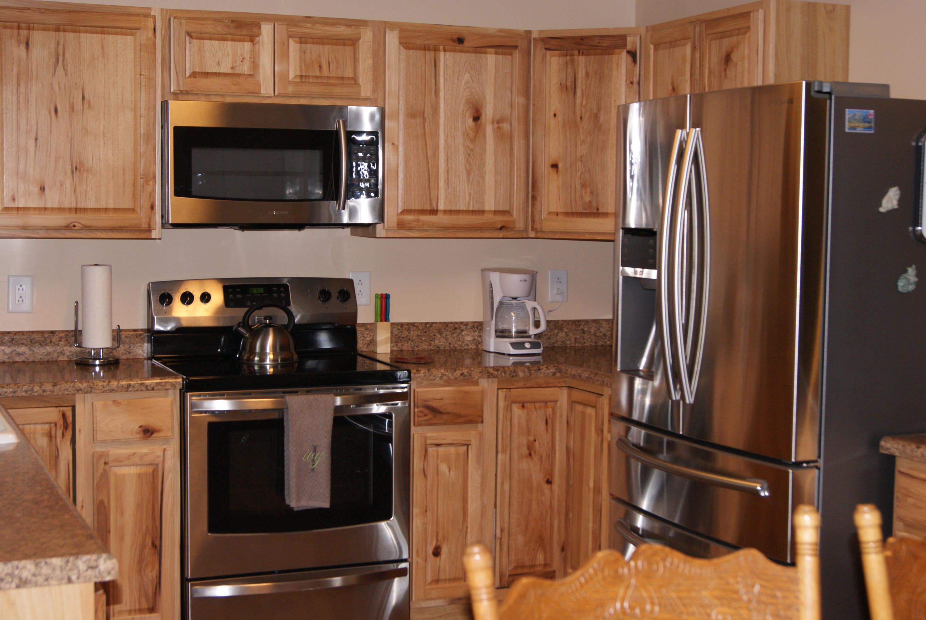 1137 Country Living Road Baker, FL 32531 - Photo 12 of 29 a kitchen with stainless steel appliances granite countertop a refrigerator stove and microwave
