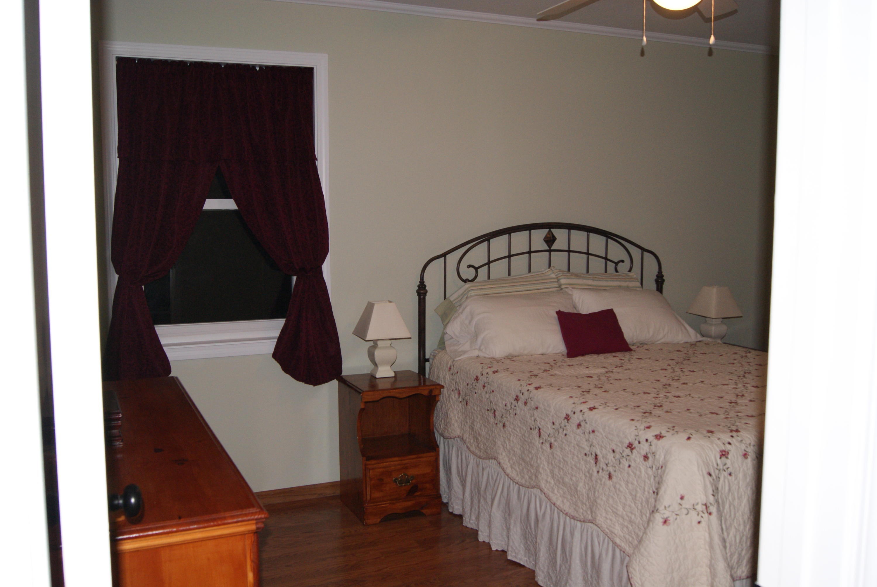 1137 Country Living Road Baker, FL 32531 - Photo 16 of 29 a view of a bedroom from a hallway