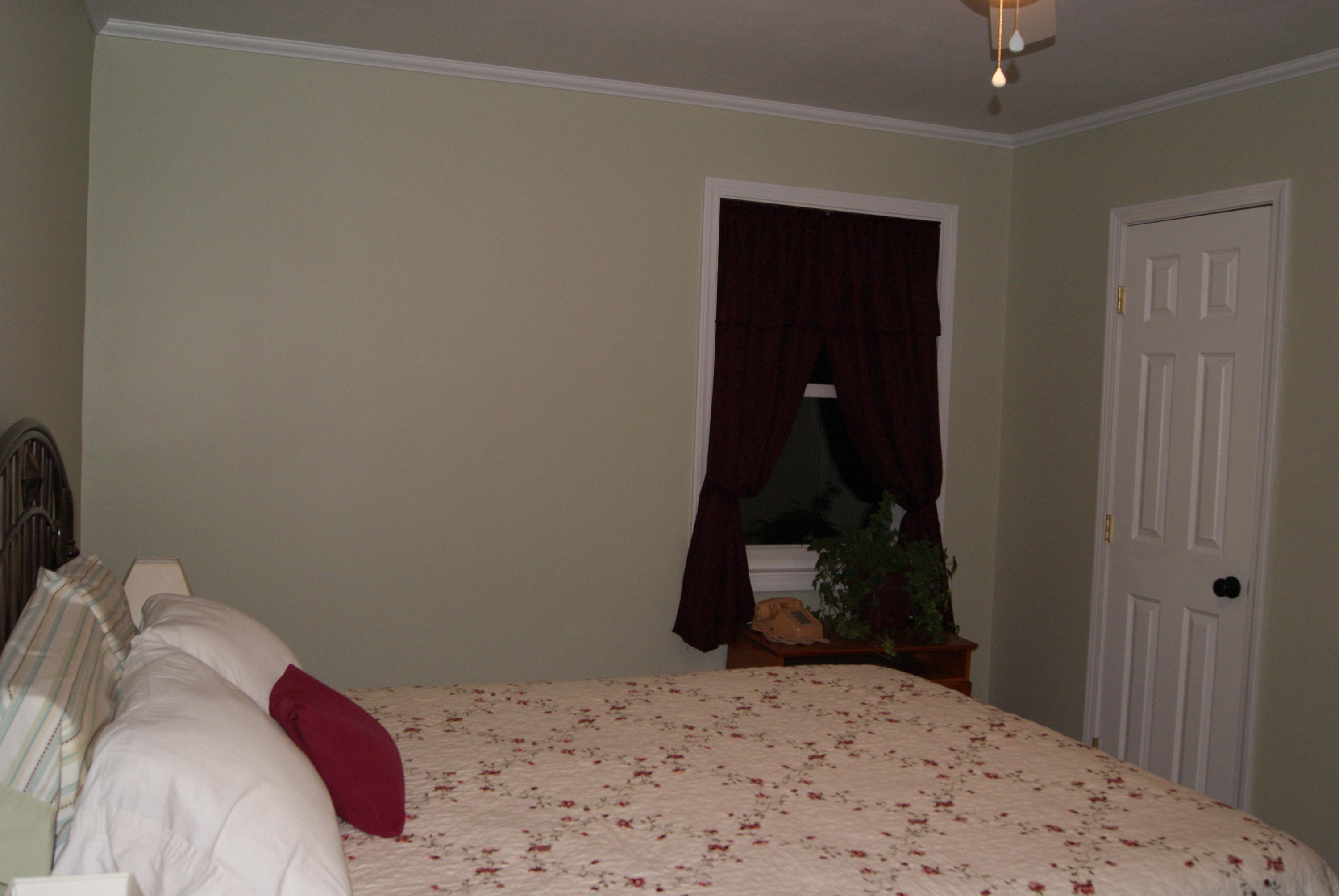 1137 Country Living Road Baker, FL 32531 - Photo 17 of 29 a bedroom with a bed and a mirror