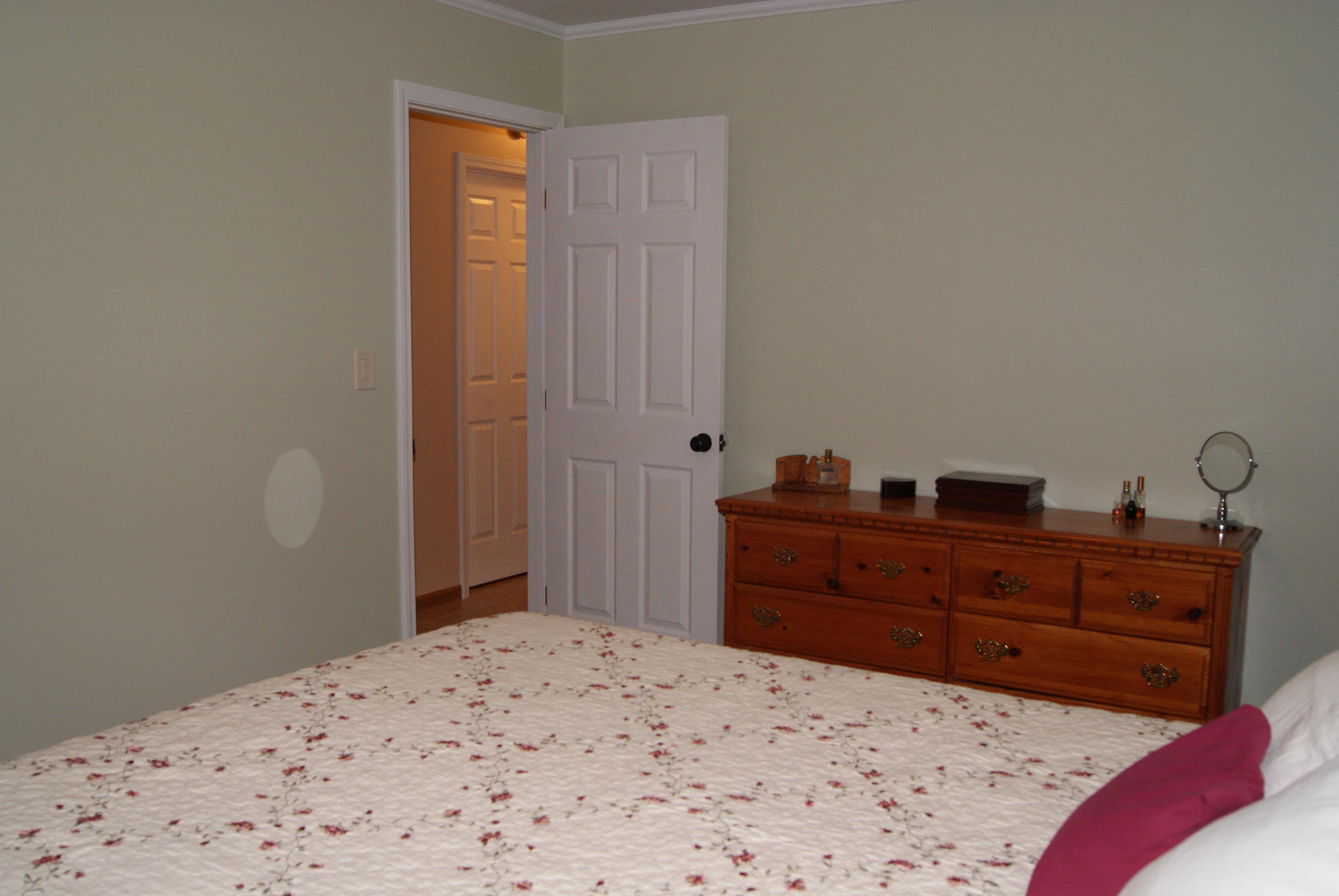 1137 Country Living Road Baker, FL 32531 - Photo 18 of 29 a bed room with a bed and a dresser