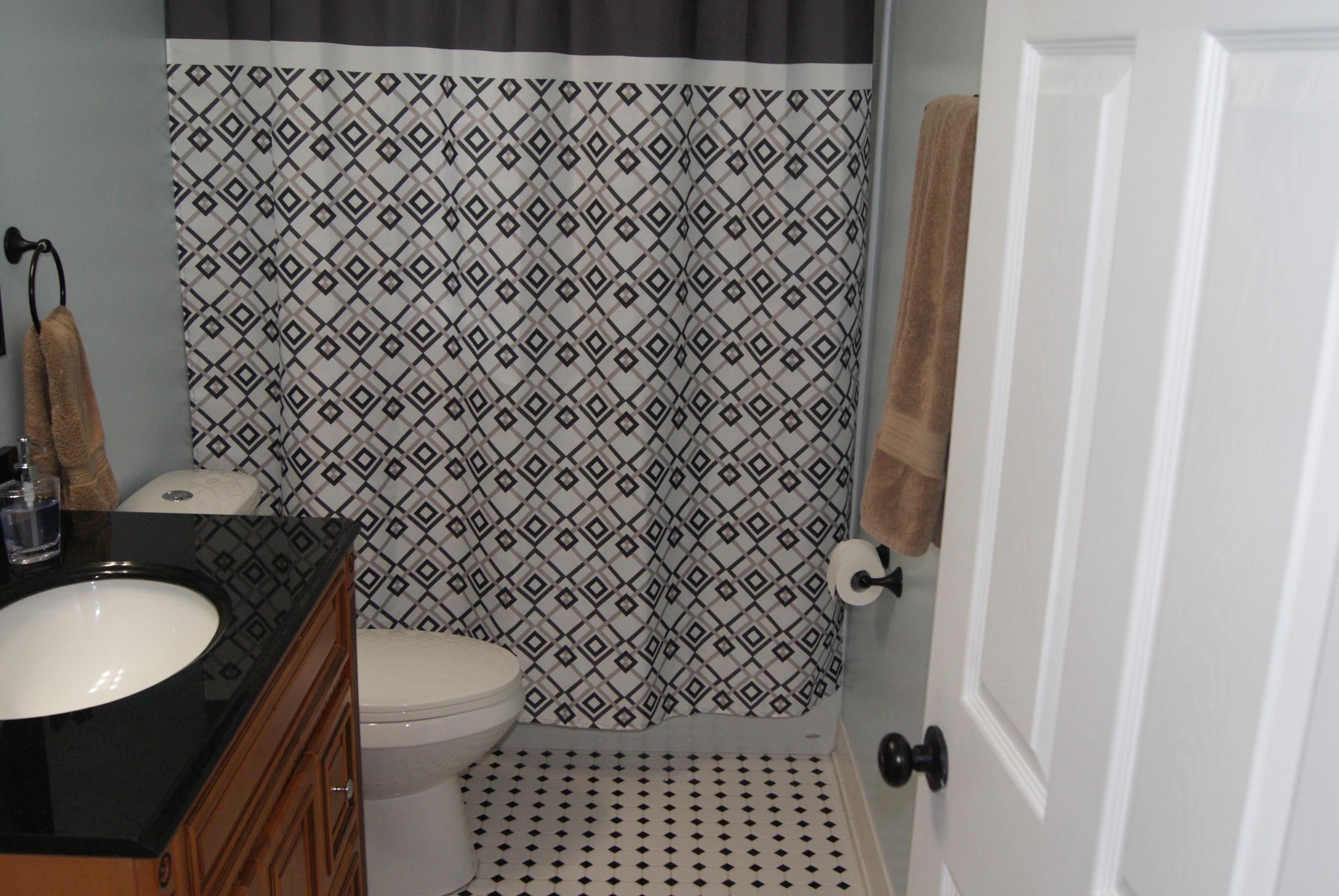 1137 Country Living Road Baker, FL 32531 - Photo 19 of 29 a bathroom with a sink and a toilet