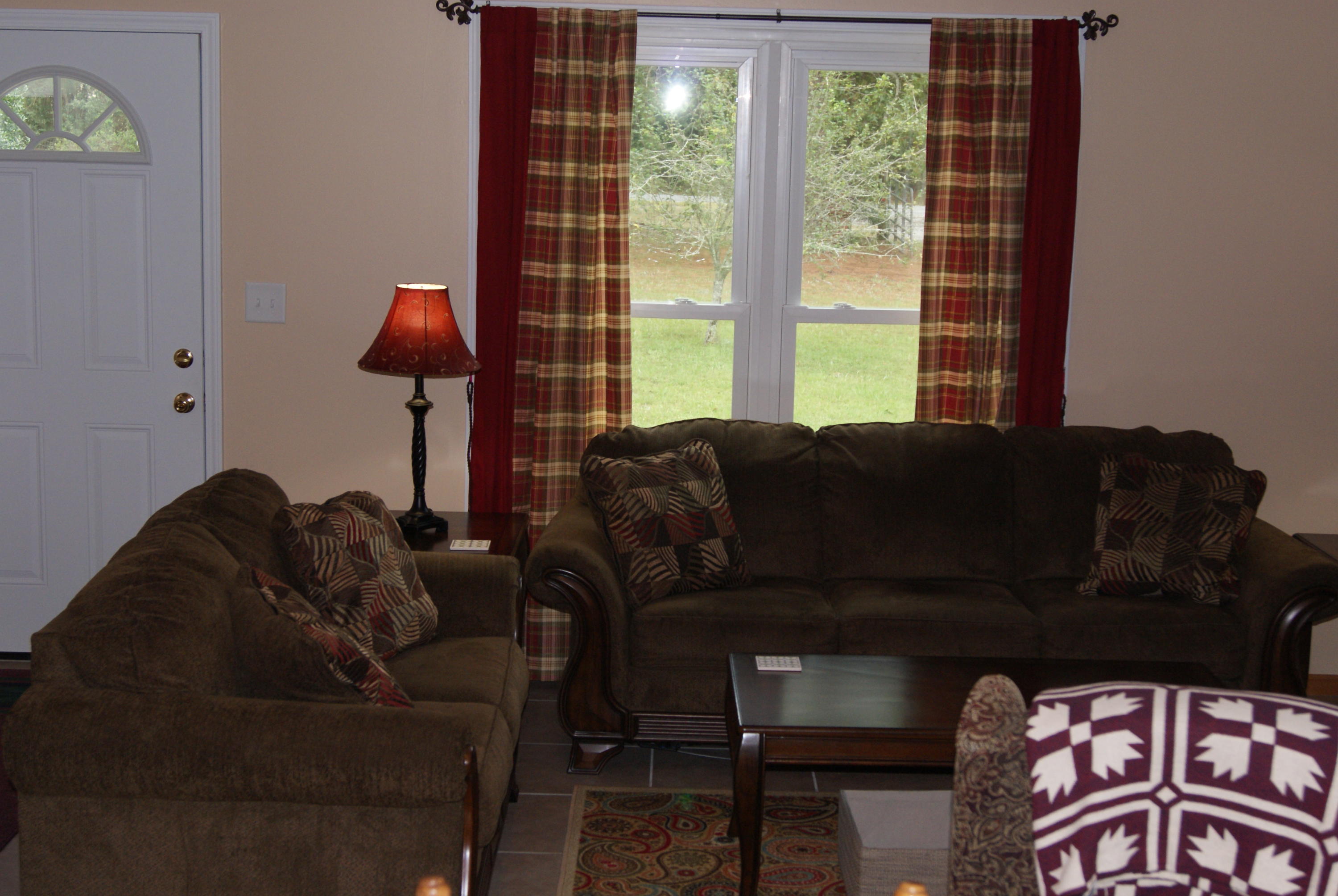 1137 Country Living Road Baker, FL 32531 - Photo 7 of 29 a living room with furniture and a window