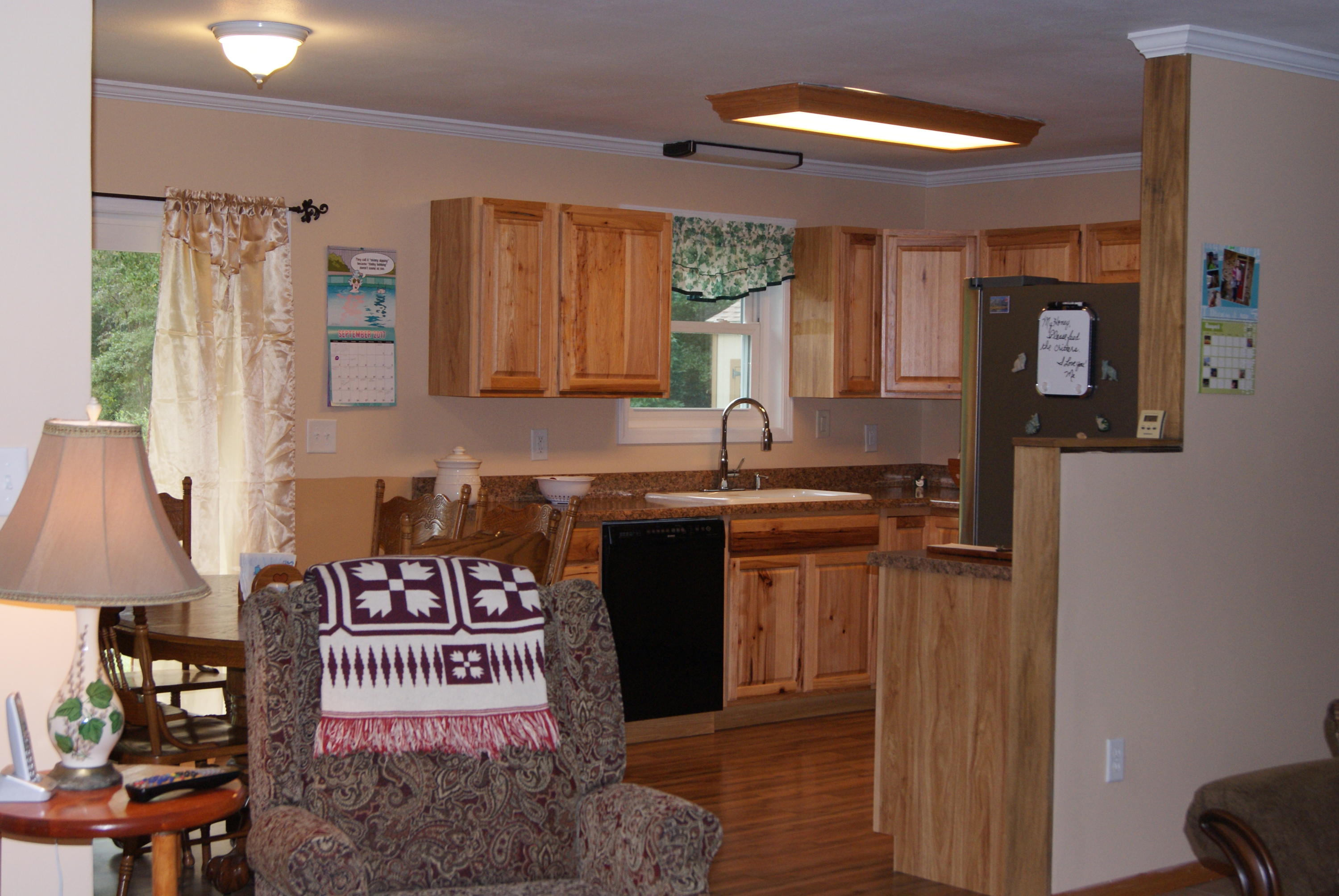 1137 Country Living Road Baker, FL 32531 - Photo 8 of 29 a kitchen with stainless steel appliances granite countertop a refrigerator and a stove
