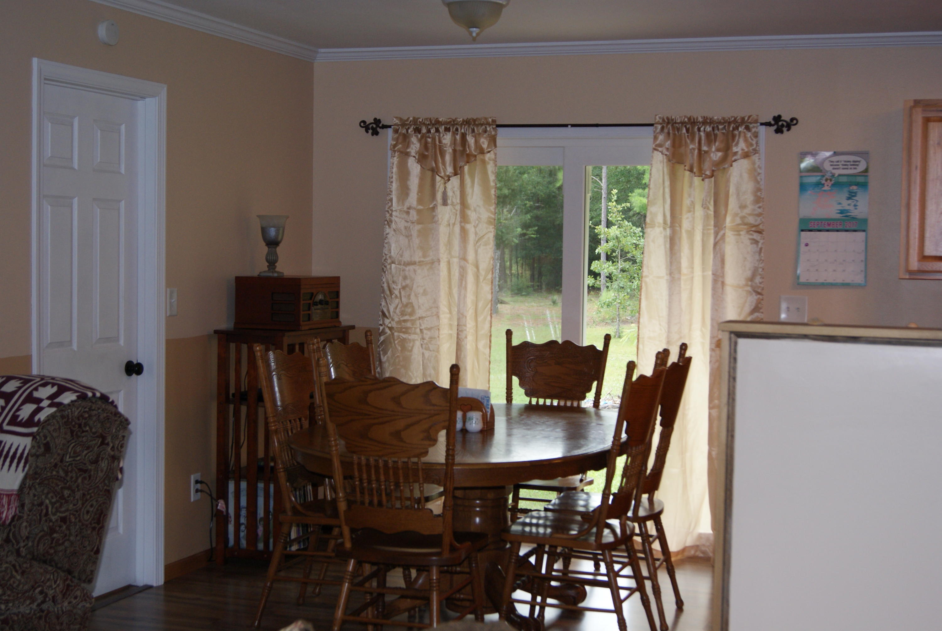 1137 Country Living Road Baker, FL 32531 - Photo 9 of 29 a view of a dining room with furniture window and outside view