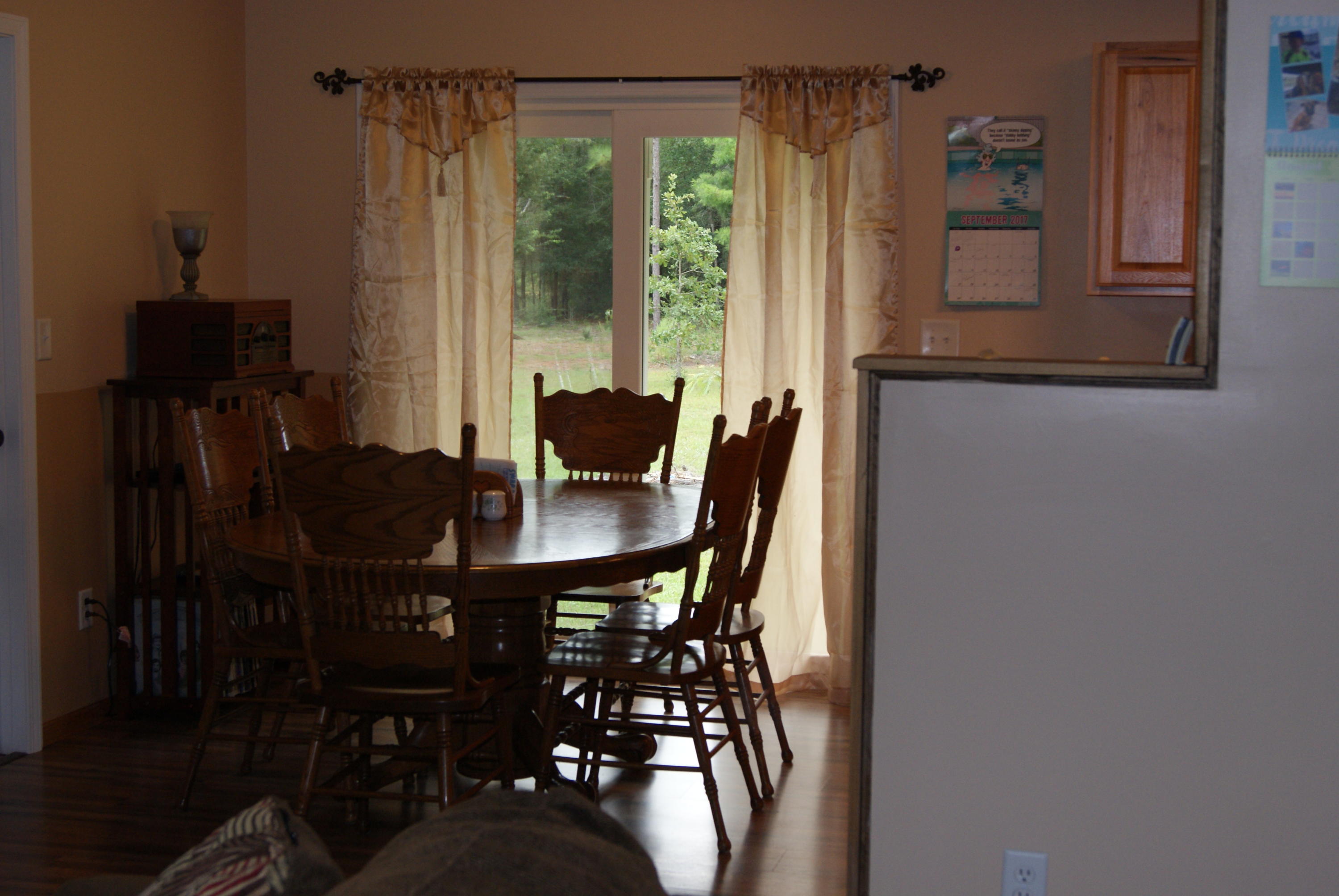 1137 Country Living Road Baker, FL 32531 - Photo 10 of 29 a view of a dining room with furniture and window