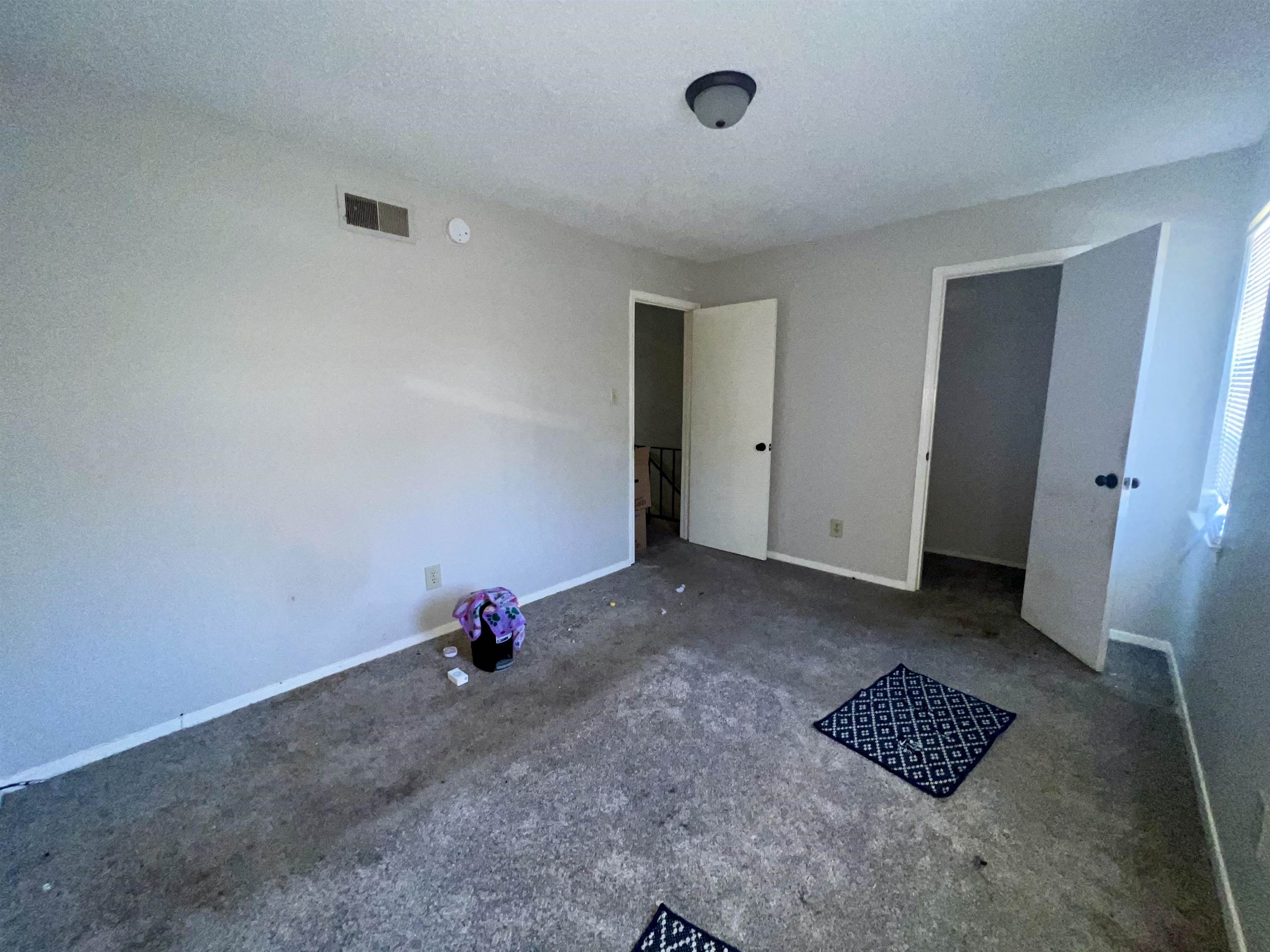 5573 Pleasant View Road, Unit 35 Memphis, TN 38134 - Photo 11 of 18 an empty room with a rug