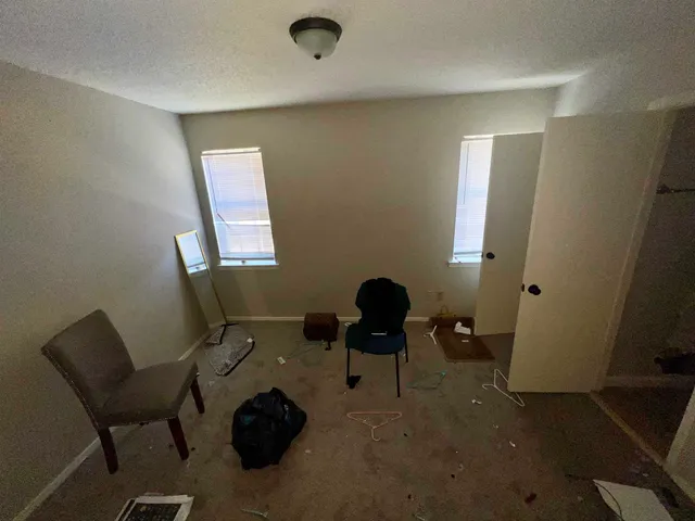 a living room with a couch and a dresser