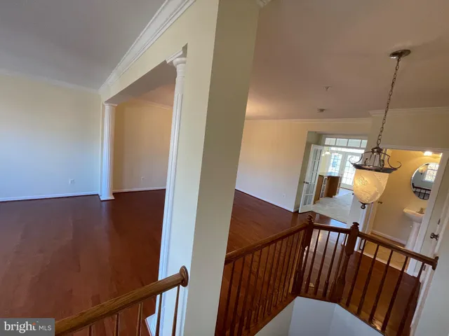 a kitchen with refrigerator and cabinets