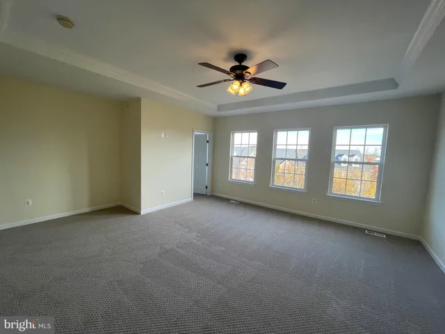 an empty room with closet area