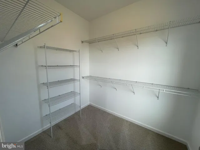 a kitchen with granite countertop kitchen island stainless steel appliances a stove sink and microwave