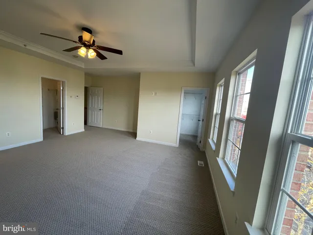 a open kitchen with kitchen island a sink a stove and a refrigerator