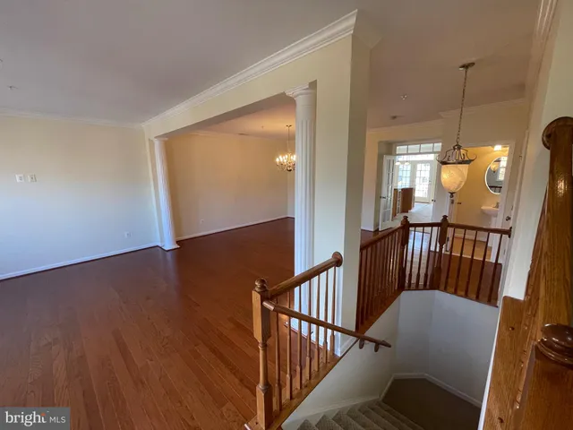 a view of a balcony with wooden floor