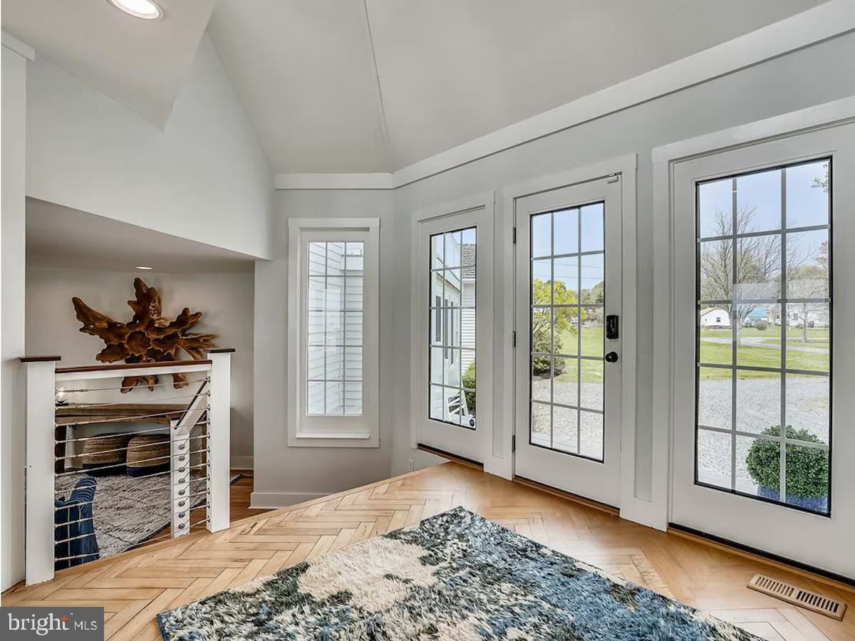 21642 Chicken Point Road Tilghman, MD 21671 - Photo 8 of 63 a bedroom with a bed and a fireplace