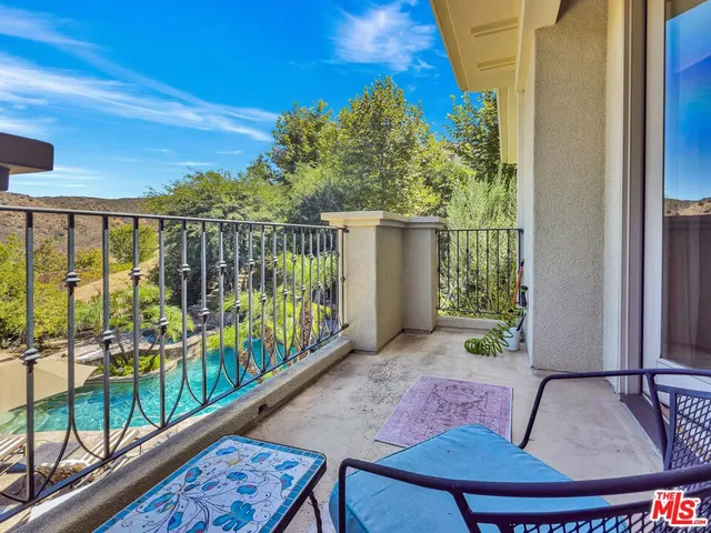 a view of balcony with furniture