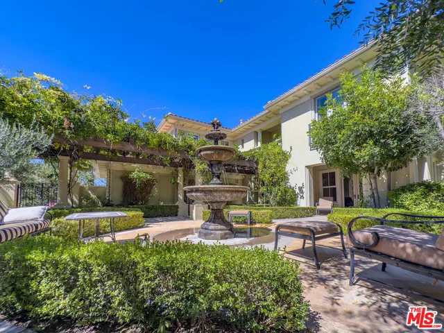 a view of a backyard with sitting area and furniture
