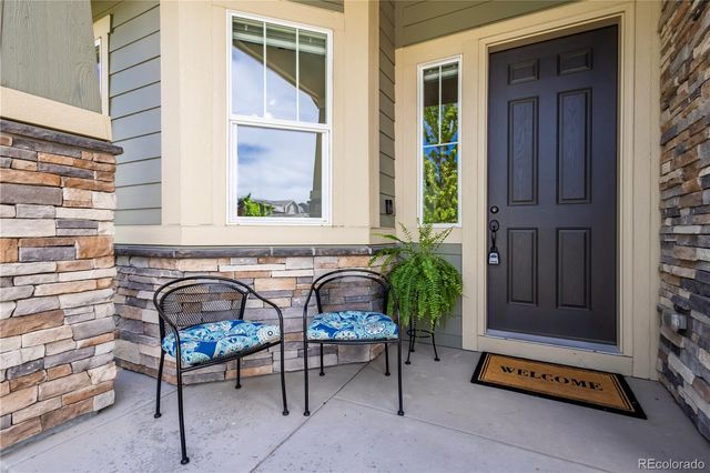 a living room with furniture and windows