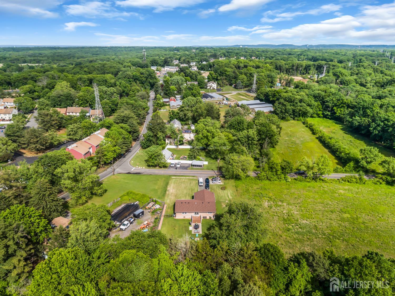 99 Schulmeister Road Old Bridge, NJ 08857 - Photo 41 of 49 an aerial view of residential houses with outdoor space and trees