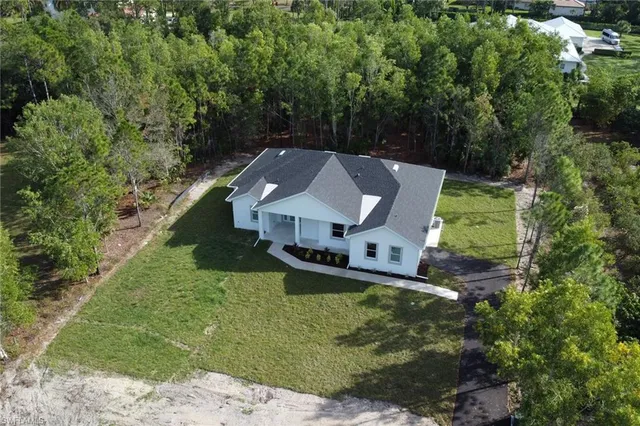an aerial view of a house with a garden