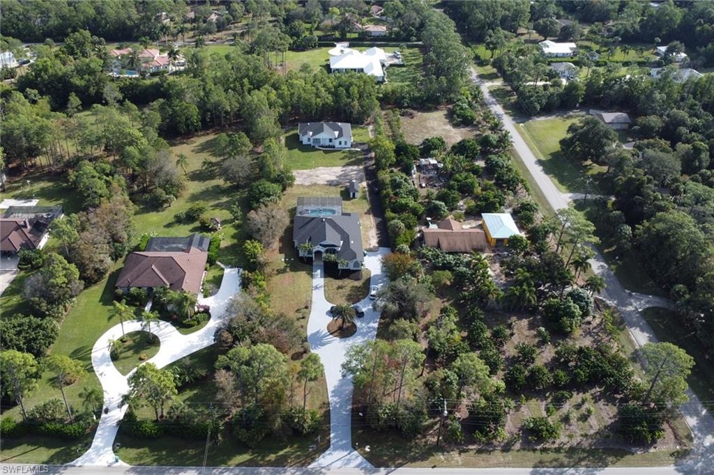 160 Logan Boulevard South Naples, FL 34119 - Photo 33 of 49 Aerial view of property and surrounding area featuring nearby suburban area