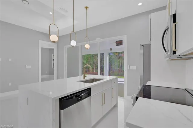 a very nice looking room with a large window and chandelier