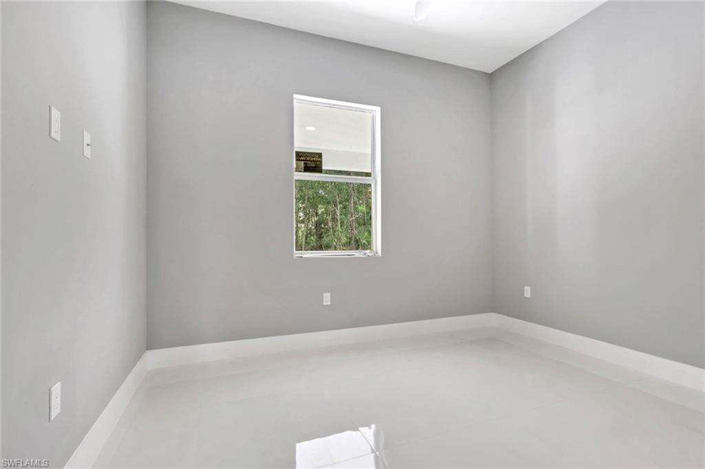 160 Logan Boulevard South Naples, FL 34119 - Photo 43 of 49 Empty room featuring light tile patterned floors