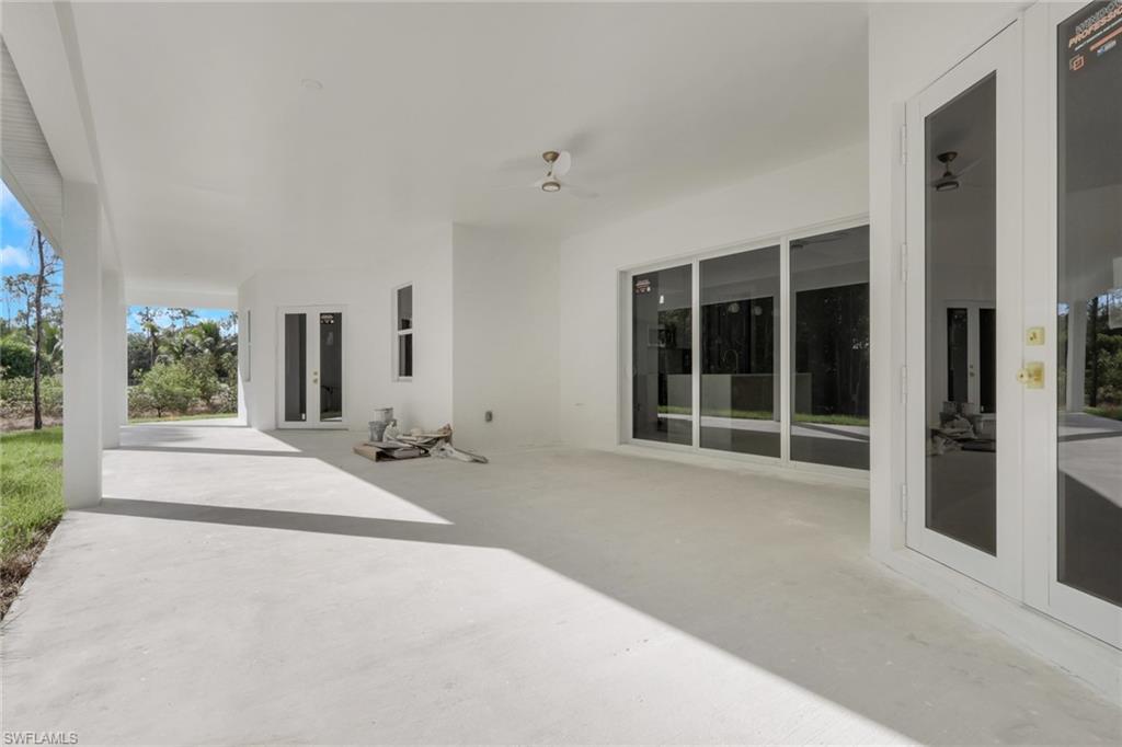 160 Logan Boulevard South Naples, FL 34119 - Photo 48 of 49 View of patio / terrace featuring french doors