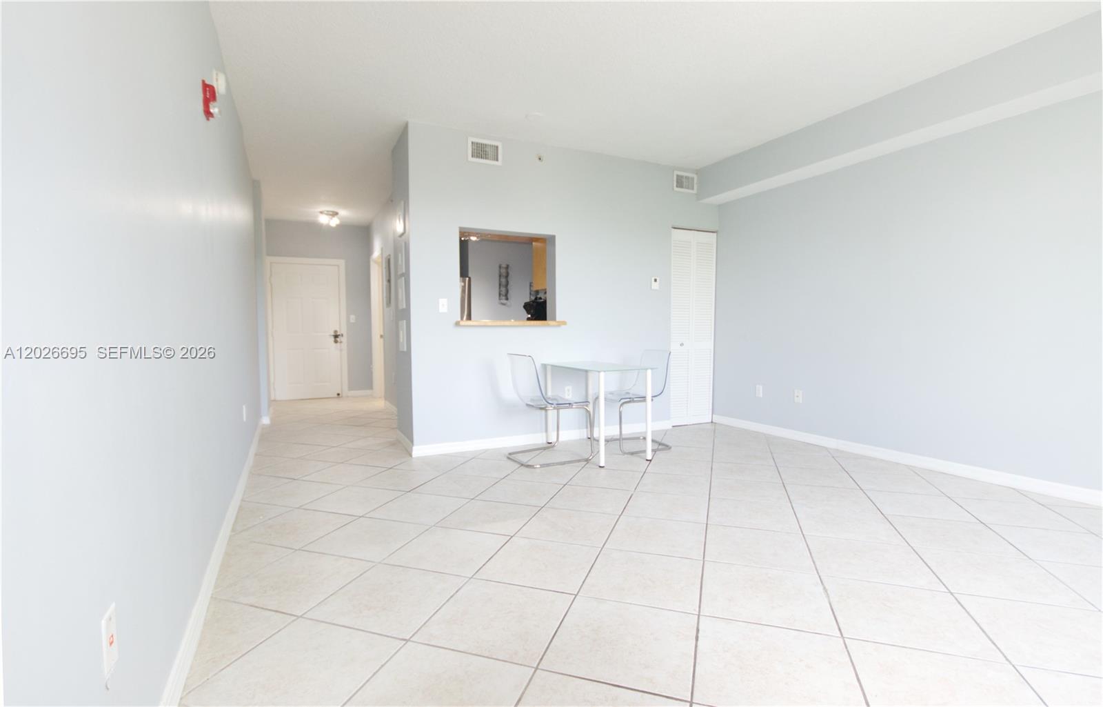 2630 Southwest 28th Street, Unit 22 Miami, FL 33133 - Photo 1 of 9 a view of an empty room with a bathroom