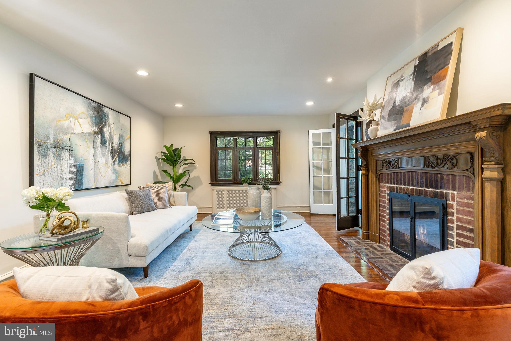 1419 County Line Road Bryn Mawr, PA 19010 - Photo 14 of 65 a living room with furniture and a fireplace