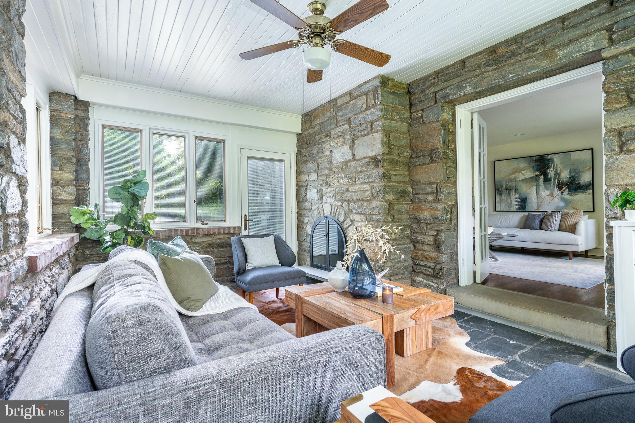 1419 County Line Road Bryn Mawr, PA 19010 - Photo 17 of 65 a living room with furniture and a large window