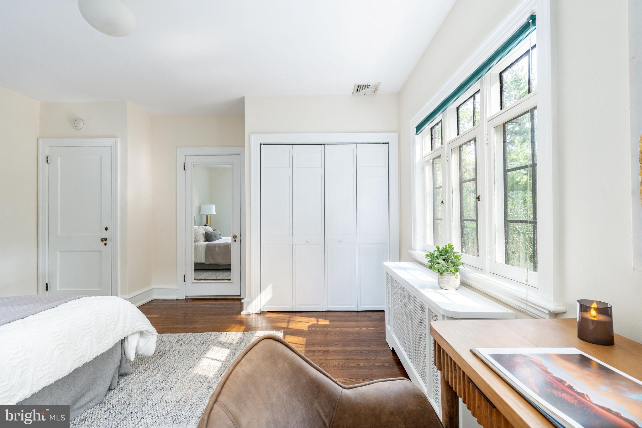 1419 County Line Road Bryn Mawr, PA 19010 - Photo 37 of 65 a spacious bedroom with a bed and a window